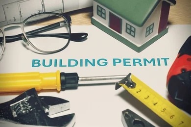 Building permit document and NOC approval for Abu Dhabi high-rise apartment move.
