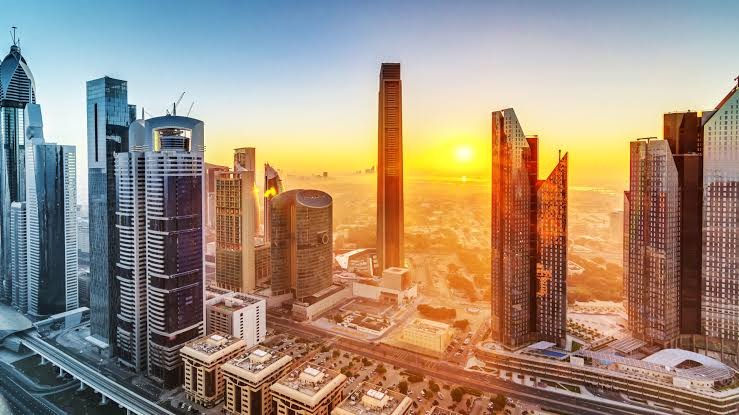 Abu Dhabi city skyline under intense summer heat and bright sunlight