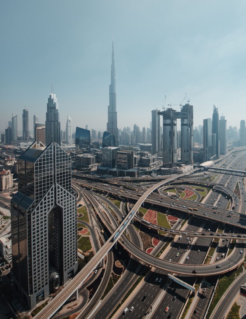 Dubai skyline and highway network representing inter-emirate corporate relocation routes for office movers Abu Dhabi.