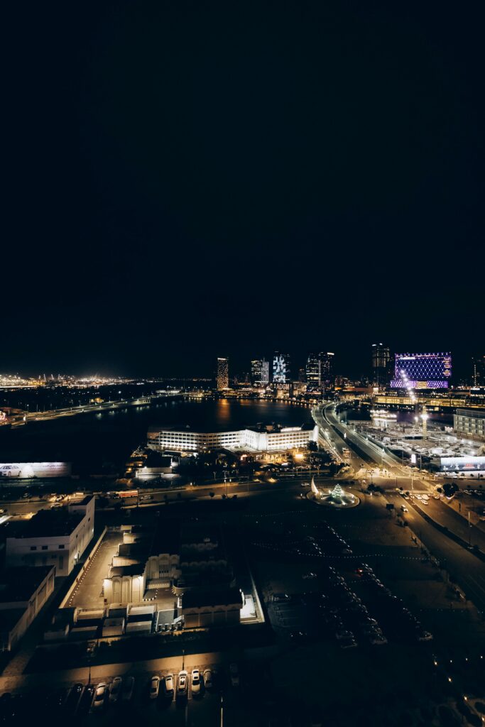 Beautiful night view of the Abu Dhabi skyline highlighting the complete service coverage of professional furniture movers Abu Dhabi.