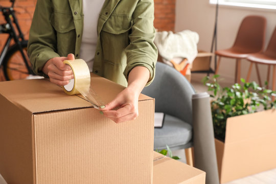 Packing cardboard boxes in preparation for a gated community move in Abu Dhabi.